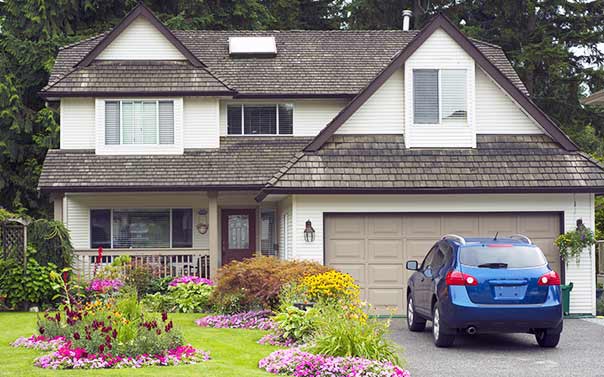 blue car parked in driveway