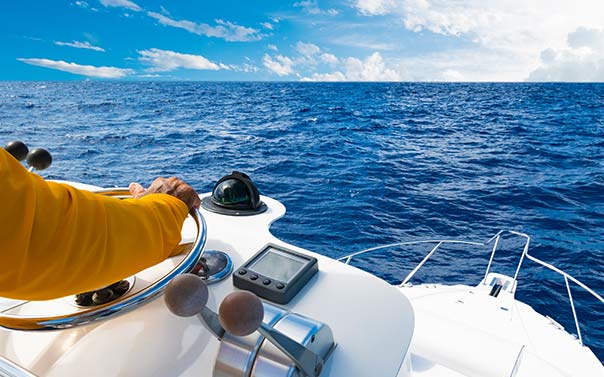 man driving boat